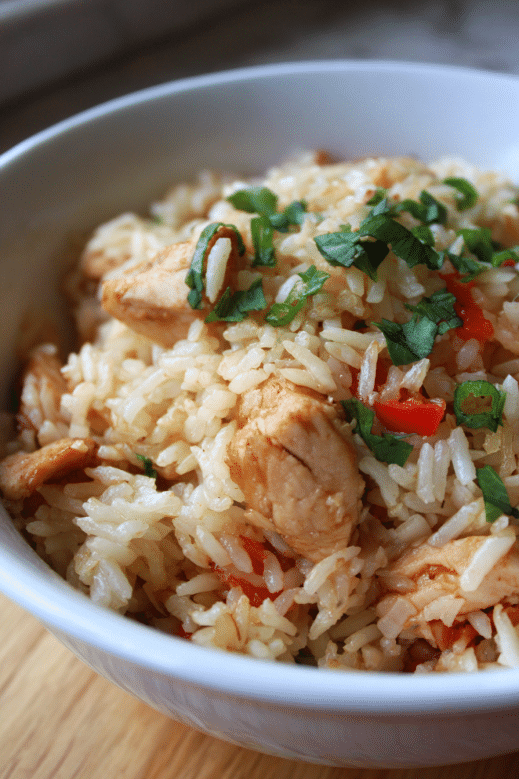 Chicken Recipe Rice Cooker – A Delicious Shortcut That Works Every Time 6 cooked chicken and rice in a bowl from rice cooker